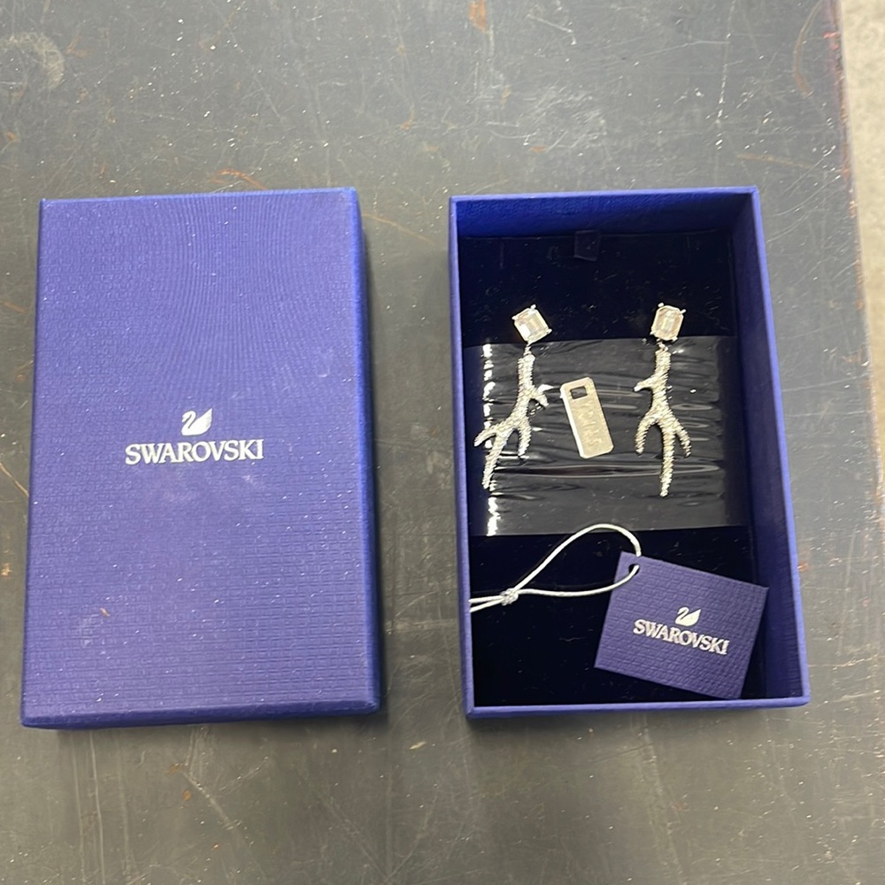Authentic Swarovski silver deer horn drop earrings.